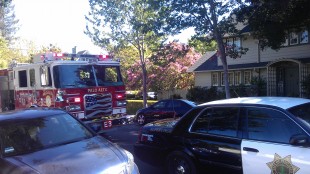Firetruck and police car parked at the scene