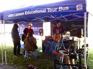 Outside the Bus, students play instruments provided by the organization during lunch on Sept. 20. Throughout the year, the Bus tours the country, helping students create and record original songs and music videos. Photo by Phoebe So.