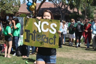 Junior Ji In Park advertises for the YCS-Youth Community Service-Club on the Quad during Club Day's extended lunch.