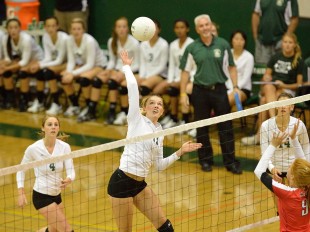 Lauren Kerr goes up for a spike in the first set of Paly's straight-set home win against crosstown rival Gunn High School.  Photo by Matt Ersted.