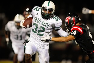 Dre Hill stiff arms a Titan defender in last year's crosstown matchup between Gunn and Paly.  The Vikings will look to Matt Tolbert on the ground this year after Hill graduated.  Photo by Matt Ersted.