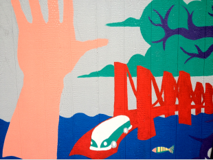 Sarah Bramlett's mural showcases a pair of arms coming out of the ocean with a series of other doodles. [Photo: Callie Walker]