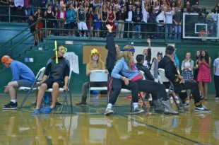 Senior Sierra Parker beats out sophomore Olivia Scola to secure a seat in musical chairs. [Photo: Cathy Rong]