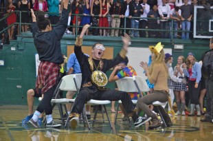 Junior Andrew Frick celebrates as he pushes a sophomore out of musical chairs. [Photo: Cathy Rong]