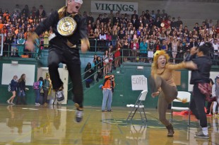 Juniors Callie Walker and Andrew Frick celebrate their win of musical chairs for the class, bringing home 400 points. [Photo: Cathy Rong]