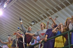 Paly juniors cheer on their classmates, Callie Walker and Andrew Frick, during musical chairs. [Photo: Cathy Rong]