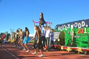 Sophomore Maggie Peng is lifted up by her peers during her classes' spirit dance. [Photo: Cathy Rong]