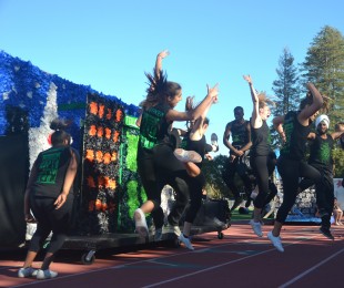 Seniors jump in synchronization during their spirit dance. [Photo: Cathy Rong]