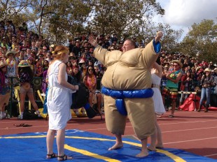 Senior Spencer Drazovich pumps up the crowd before his sumo wrestling match on the second day of Spirit Week.  He went on to win first place over junior Andrew Frick.  Photo by Jared Schwartz.