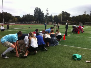 The juniors and the freshmen prepare to face off in the first round of the tug-of-war battle. Photo by Paige Esterly.