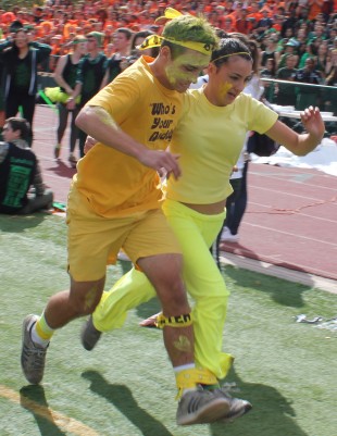 Juniors Josh Totte and Andrea Clerici-Hermandinger sprint to end of the three-legged race in the final round against the seniors, winning the relay race. Tomorrow's rallies will include a hula hooping and tug-o-war activity during lunch and a three-point contest and dunking basketball competition during Advisory. Photo by Phoebe So