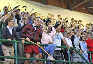 Senior citizens (Seniors) cheer for their team mates for the slam-dunk competition. [Photo: Cathy Rong]