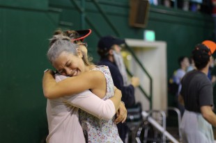 Senior Bria Vinceti huggs a friend after the senior victory in the slam-dunk competition. [Photo: Cathy Rong]