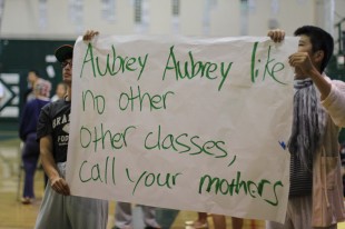 Seniors hold up their cheer for Aubrey after he wins the slam-dunk contest. [Photo: Cathy Rong]
