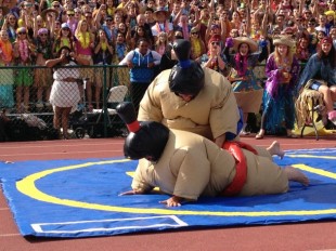 Concerns have been raised over student safety during Spirit Week, particularly during the sumo wrestling competition. In this photo, junior Andrew Frick takes down sophomore Nick Beeson. Photo by Jared Schwartz