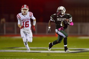 Senior running back Justin Gates-Mouton runs past a Saratoga High School defender for a long touchdown in the third quarter of Paly's homecoming win over the Falcons Friday night.  Photo by Matt Ersted.