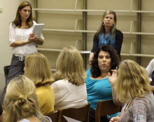 College Counselor Sandra Cernobori explains to TAs how the change may or may not affect current seniors. There was some confusion as to how the UCs will review applications and how many students this change will impact. Photo by Grant Raffel.