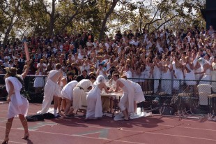 Seniors fashioning togas cheer for their best dressed on day two of Spirit Week at the football field at lunch.  The seniors will be wearing green tomorrow.  Photo by Jared Schwartz.
