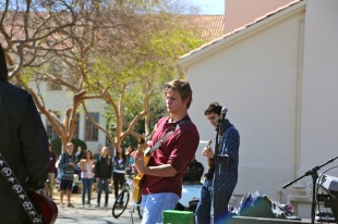 Senior Ben Cook plays guitar during Paly Rocks. Photo by Cathy Rong