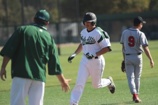 Senior designated hitter Isaac Feldstein trots around the bases after blasting a solo home run in the fifth inning. Feldstein's third home run of the week trimmed the Titans' advantage to 2-1.