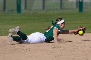 Junior shortstop Hannah Bundy dives to her left to field a sharp ground ball during the third inning of Paly's loss to Leland High School Saturday.  Photo by Matt Ersted.