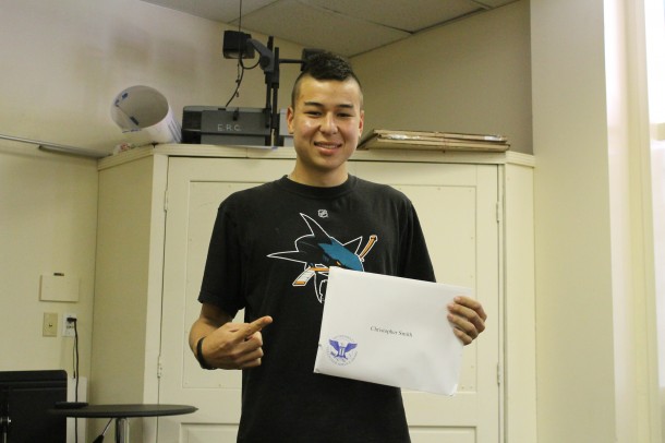 Junior Chris Smith poses for a picture after receiving his President's Award.