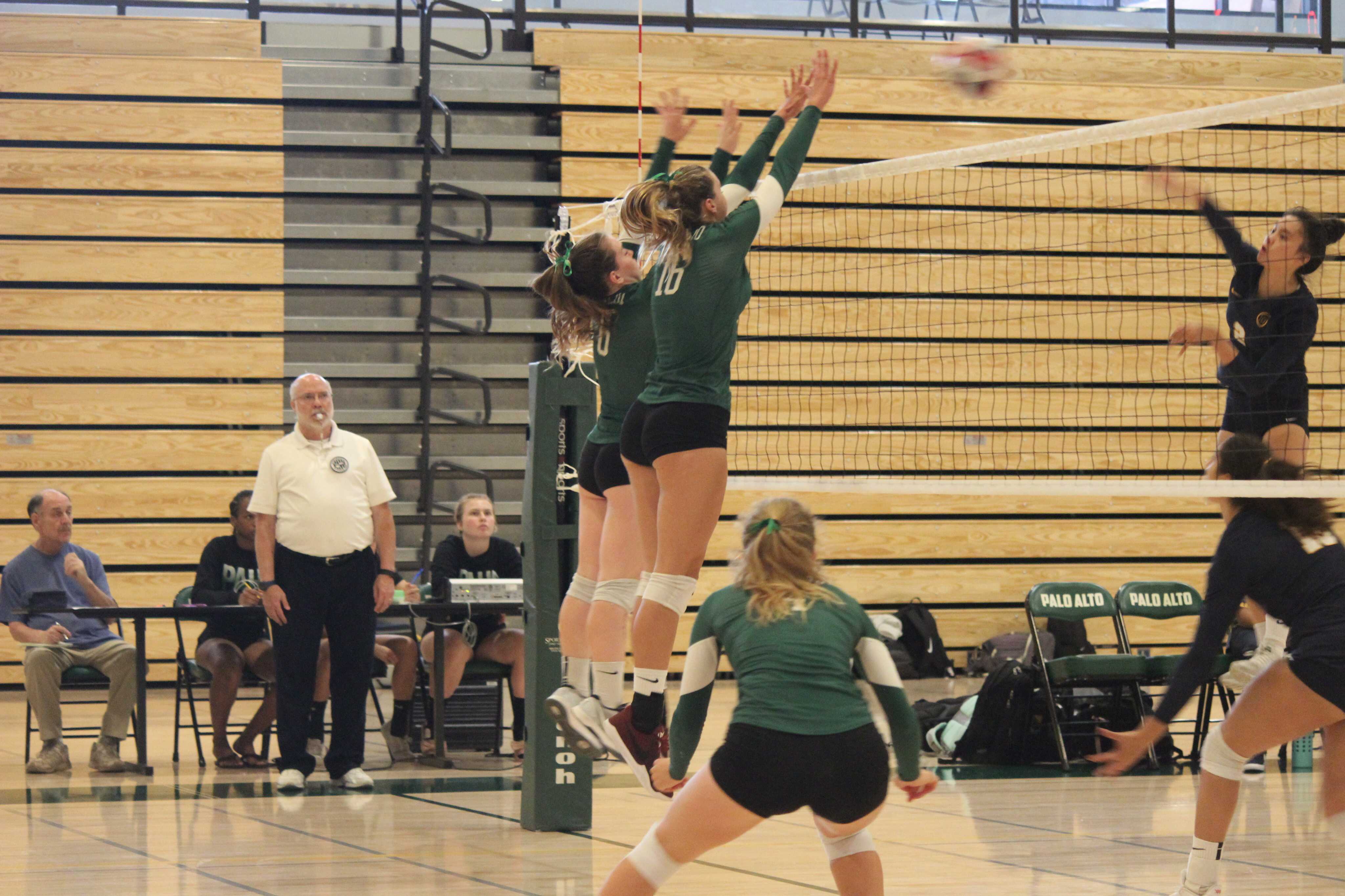 Sophomore Amelia Gibbs (right) and junior Mallory Kuppe (left) block a strike against Menlo School. The Vikings would end up winning the match in three straight sets. Photo by Ellie Krugler