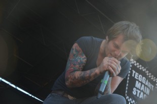 Caleb Shomo, the lead singer of Attack Attack!, performs at the Vans Warped Tour in 2011.  Photo by Cathy Rong. 