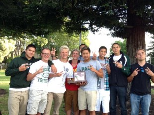 Paly Boy's swimming pose with after winning second at CCS. Photo by Sam Kelley.