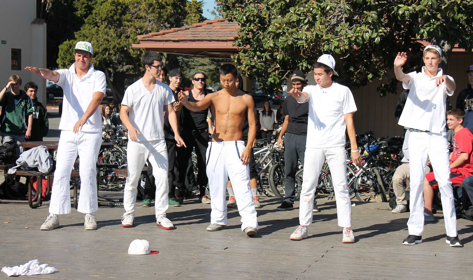 EVENT members, seniors Jack Anderson, Frankie Comey, Andrew Liang, Chris Smith and Blake Smith (left to right) perform an 'N Sync-Backstreet Boys medley on the Senior Deck. Photo by Eric Lu.