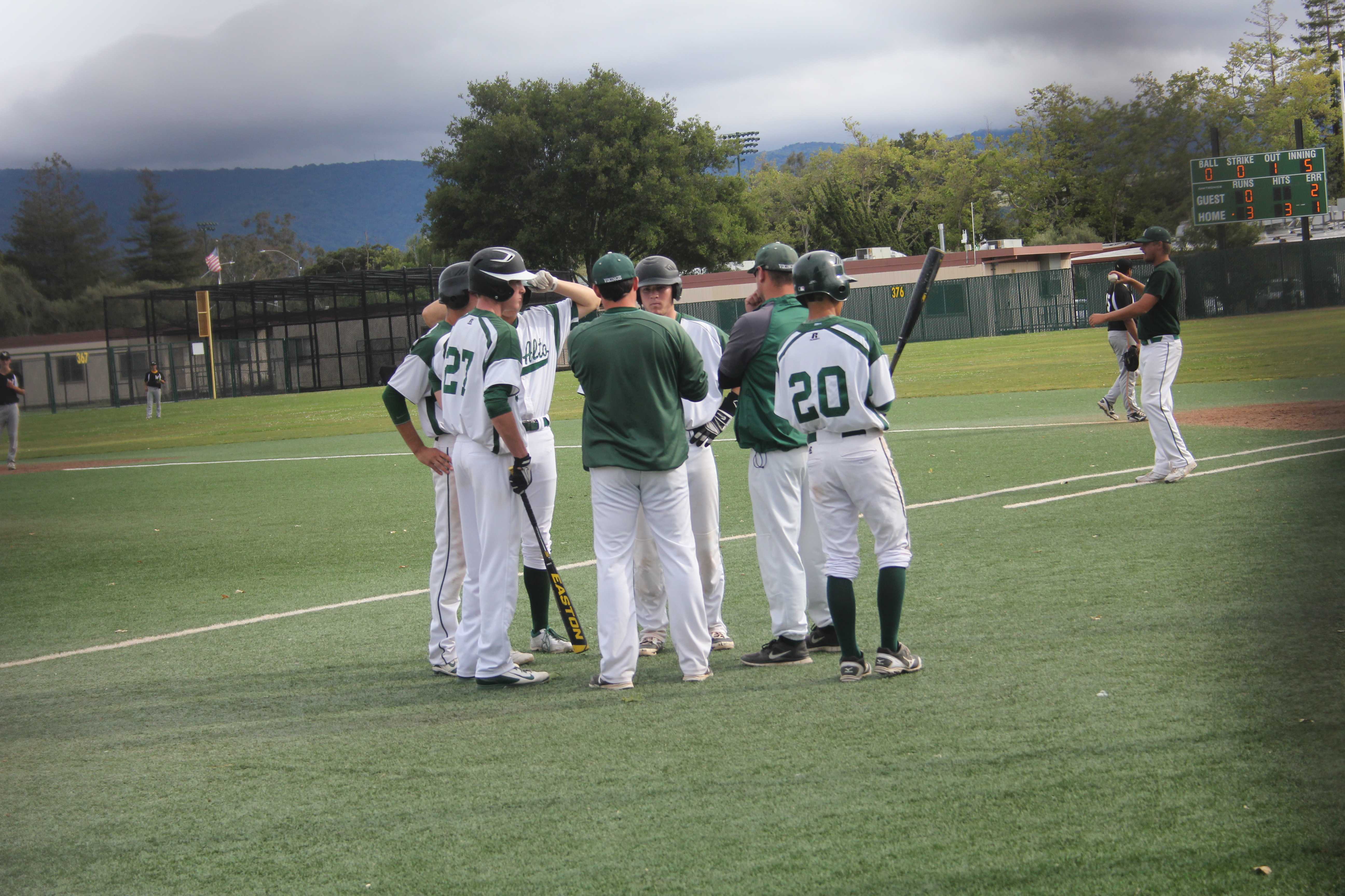 Paly head coach Erik Raich talks it over during a Wilcox pitching change.  Paly went on to win the contest 5-0 and clinching a SCVAL championship series birth.