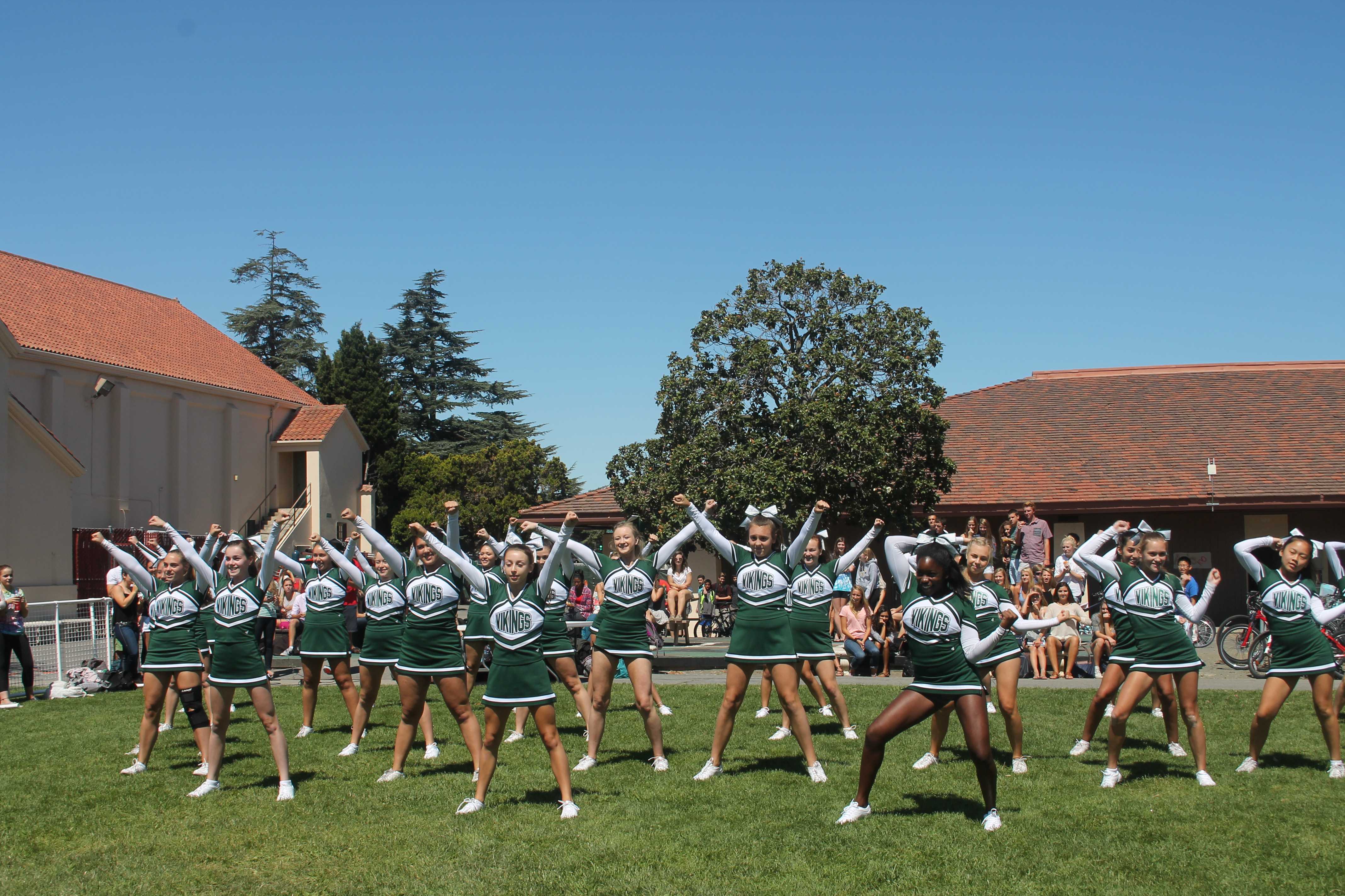 The Paly Cheer Team strikes a pose on the Quad during the first rally of the year. Photo by Chloe Fishman. 