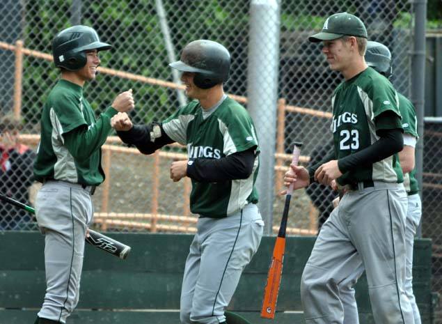 Pederson high fives a teammate after hitting a home run for the Vikings. Photo by the Viking Magazine.