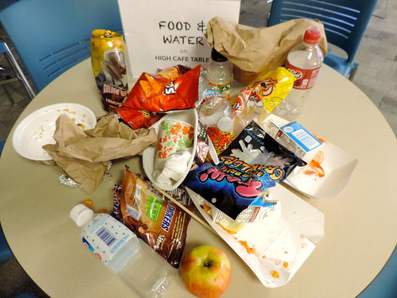 Three piles of trash were left out on Monday, leading teachers to restrict students from eating in the building. The restriction will last for one week. Photo courtesy of Margo Wixsom.