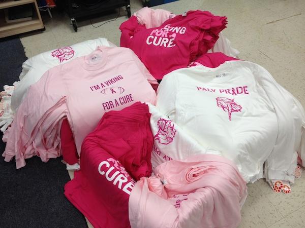 Boxes of ASB's breast cancer awareness shirts lay on the floor of the S