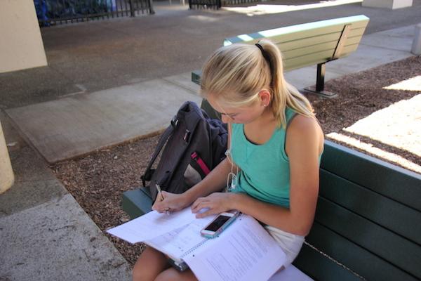 Freshman Olivia Fernandez uses her iPhone to work on her homework during her prep. Photo by Ana Caklovic.