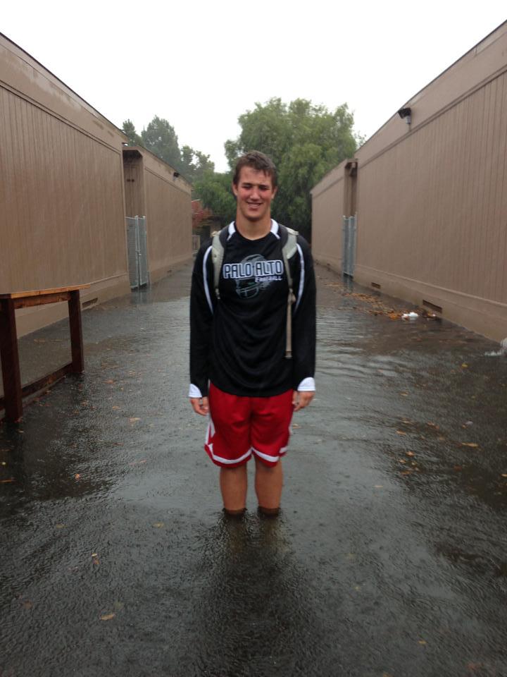 Paly alumnus Jack Anderson goes puddle jumping during a storm in November 2012. While flood control at Paly has improved over the past two years, we do not recommend puddle jumping in severely affected areas. Photo by Keri Gee. 