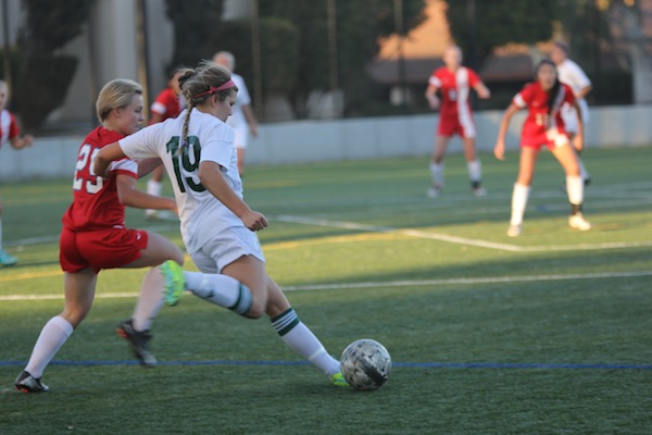 Junior utility player prepares to kick a long ball in a game last year. The Palo Alto High School girls’ soccer team beat the Saratoga Falcons, 3-0, on Jan. 15 at home.