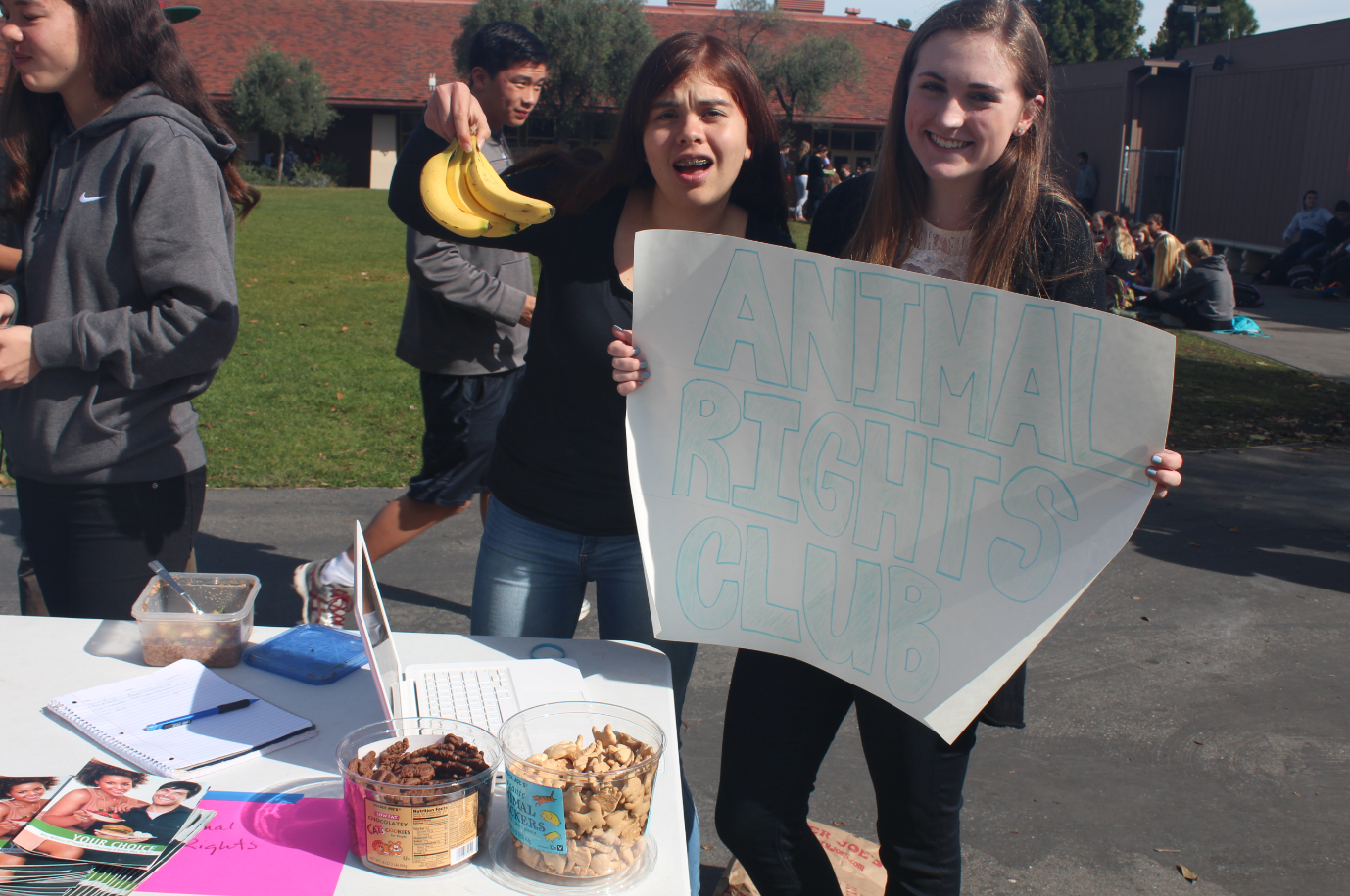Junior club founders Chelsea McIntosh and Danielle Bisbee advertise for their club, which urges students to stand up against animal cruelty. 