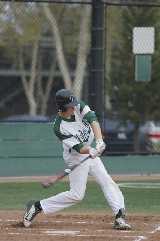 Junior infielder Justin Hull swings at a pitch. Hull, a three-sport varsity athlete for football, basketball and baseball, went one for three and scored one run. Photo by George Lu.