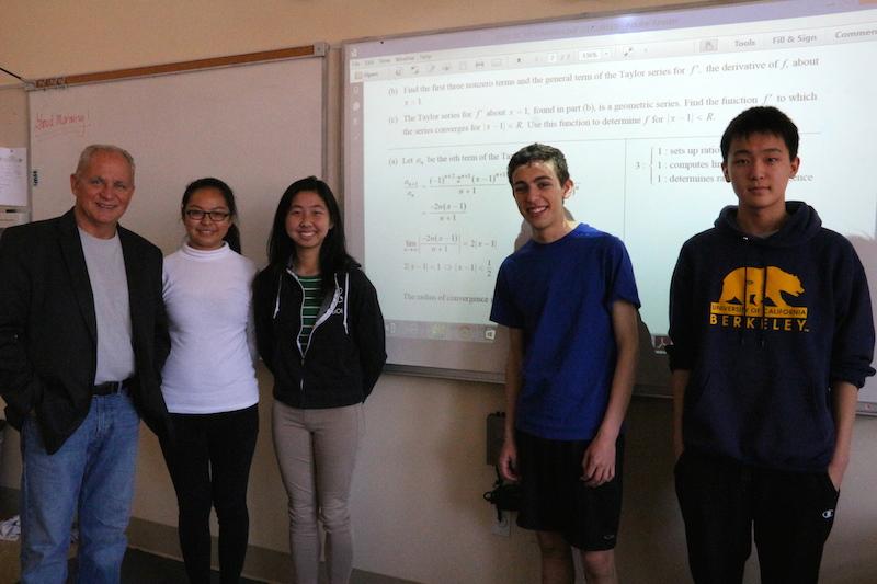 Palo Alto High School teacher Radu Toma and juniors Allison Zhang, Kathryn Li, Eric Foster and Andrew Lee (left to right) pose in their Advanced Placement Calculus BC class. The team wrote up its solution for the International Mathematical Modeling Challenge competition from April 19 to April 23. Contest results will be out in June. Photo by Lizzie Chun.