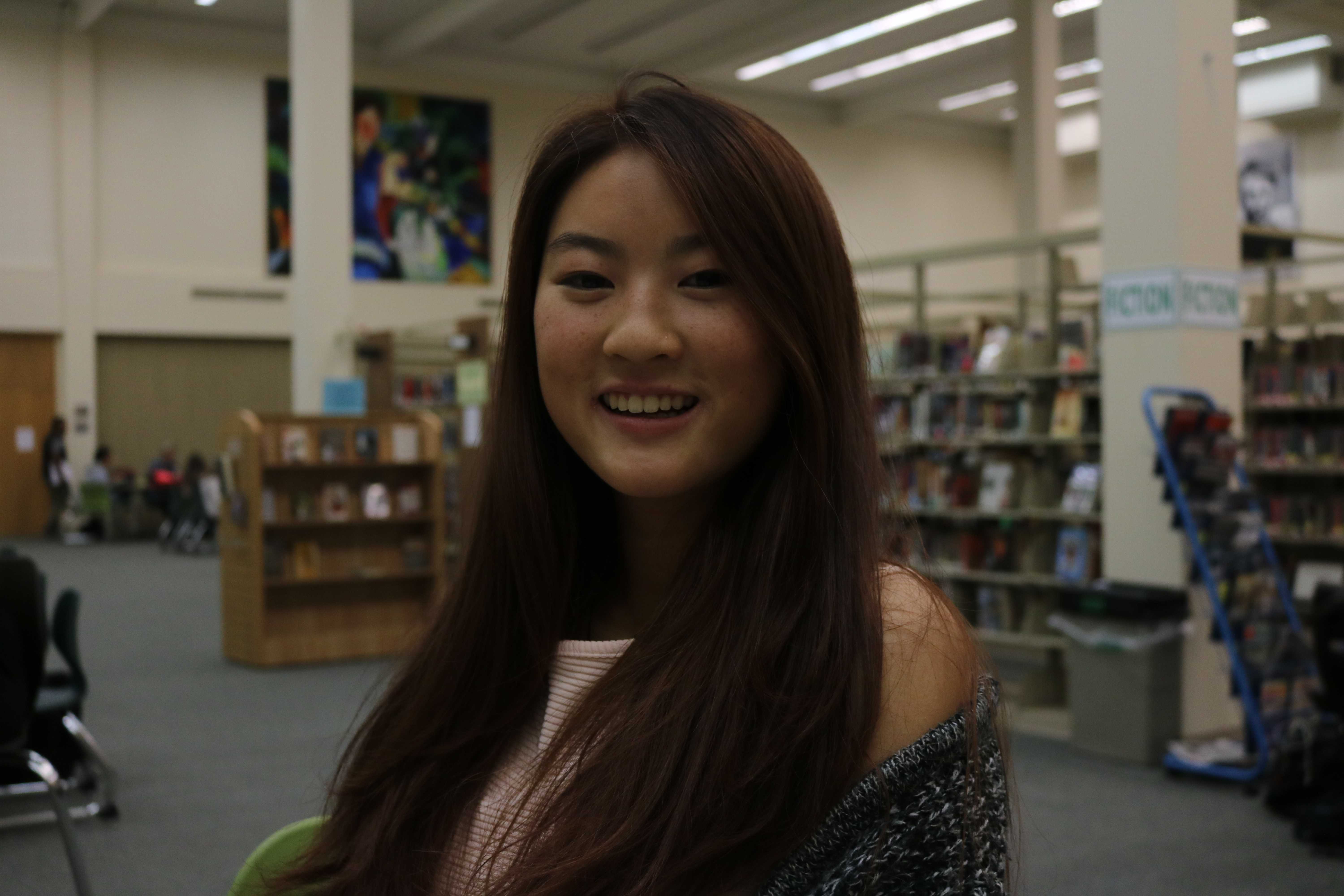 Senior Karina Chan. "You’re really getting a bang for your buck," Chan said. "It won’t cost extra to get rid of a watermark or anything like that, so it [getting pictures taken by students] makes a lot of sense." Photo by Emma van der Veen.