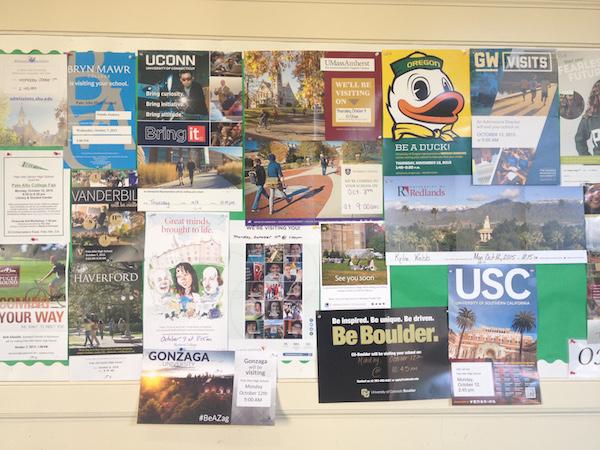 Visiting the College and Career Center in the administration building is a great way to keep updated on applications and attend college representative visits. This poster outside the center displays flyers from every college that visits Paly. Photo by Maya McNealis.