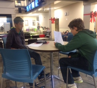 Sophomores Devin Ardeshna and Charlie Baldwin help each other study for their classes.