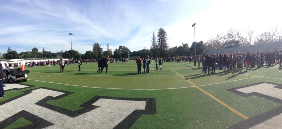 Students gather at the football field after a fire alarm went off. According to Assistant Principal Jerry Berkson, the alarm was set off by rewiring the electricity. Photo by Adele Bloch