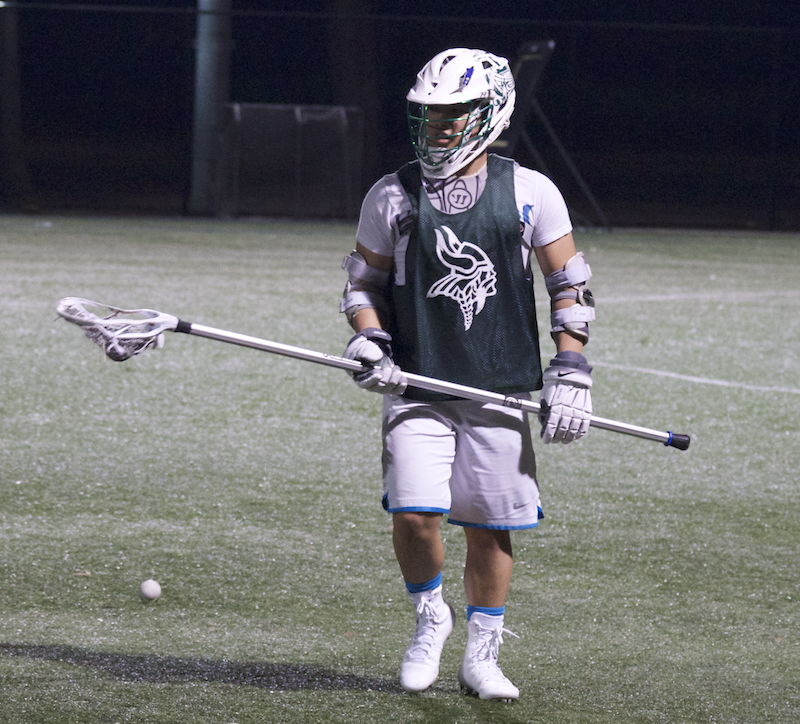 Long stick defender Trevor Woon rotates positions in a drill during preseason practice. The season starts on Mar. 4.