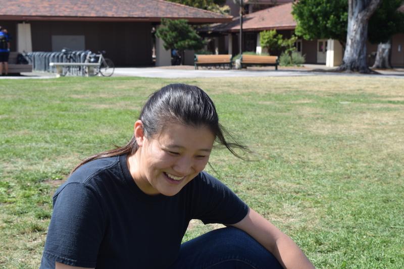 Senior Jenny Xin describes her muical ventures and prefrences during her sit own with the Paly Voice. Photo by Nika Woodfill. 