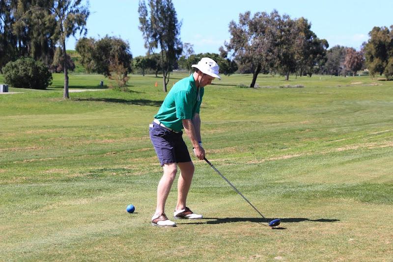Senior captain Henry Gordon tees off in a match early in the season against Los Altos High School. Gordon will play golf next year at Occidental College. Photo by Cooper Lou.