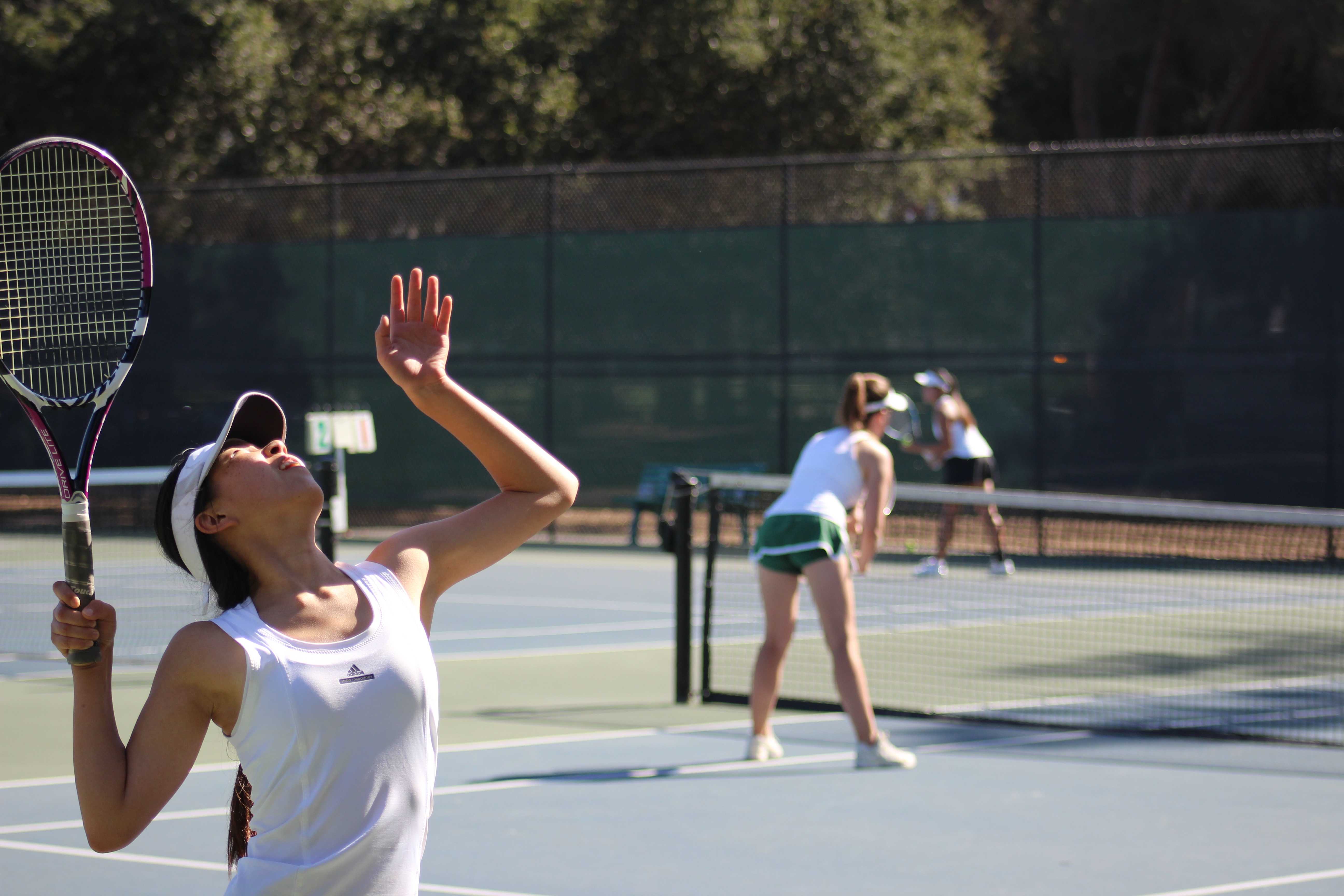 Senior Alice Zhao prepares for a serve in a doubles match Thursday. The pair helped boost the team to a dominant 5-2 win. Photo by Sid Sharma.