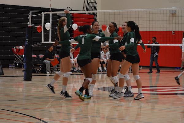 The Vikings celebrate last night in the Gunn High School gym. According to Viking head coach Jekara Wilson, the match was an emotional and mental ordeal for the team. "Obviously emotions are running high," Wilson said. "It's definitely a mental match more than anything."